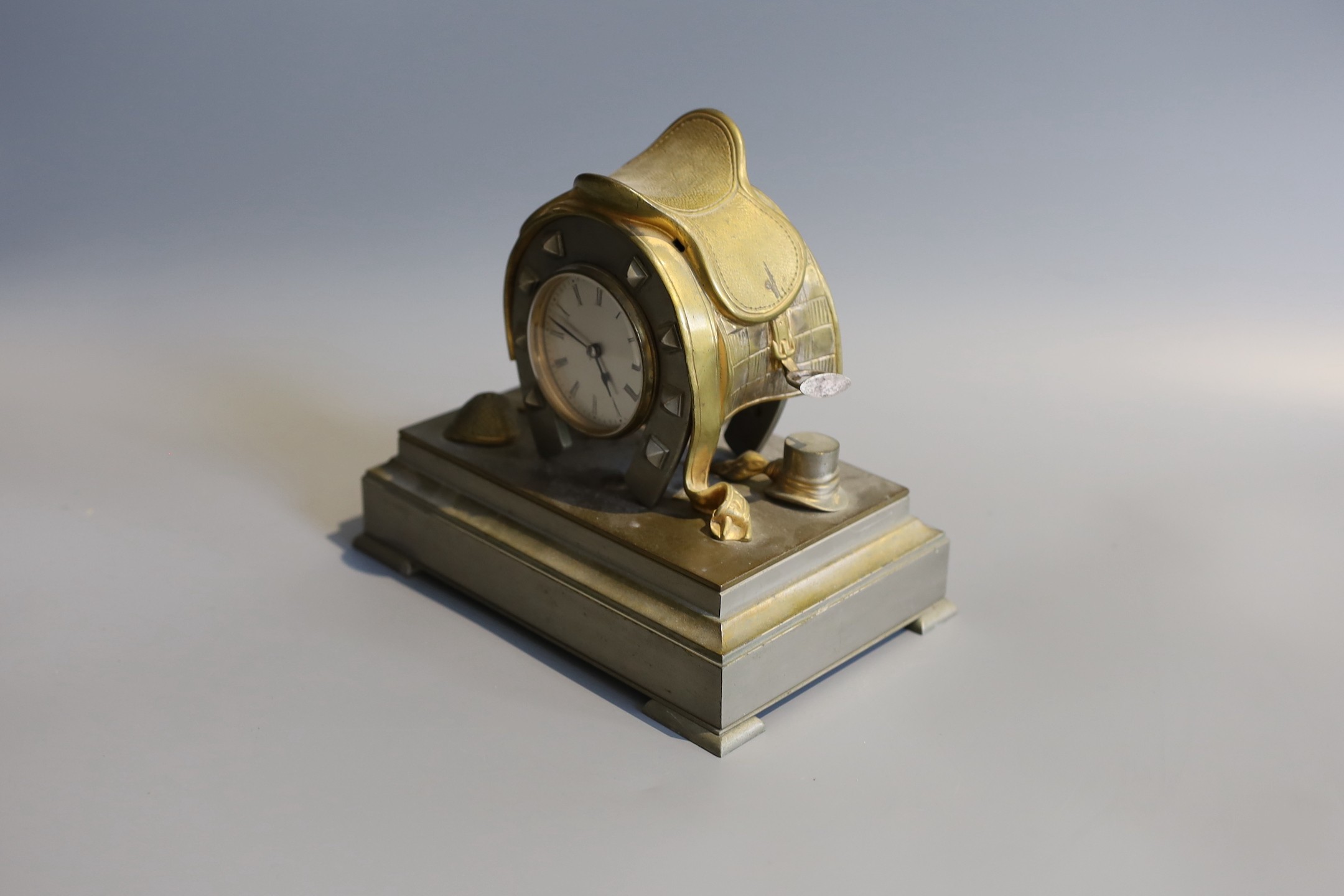 A Victorian brass metal equestrian themed desk timepiece, width 20cm height 19cm